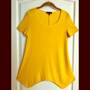 Slinky Brand top. Short sleeves and sharkbite hem.